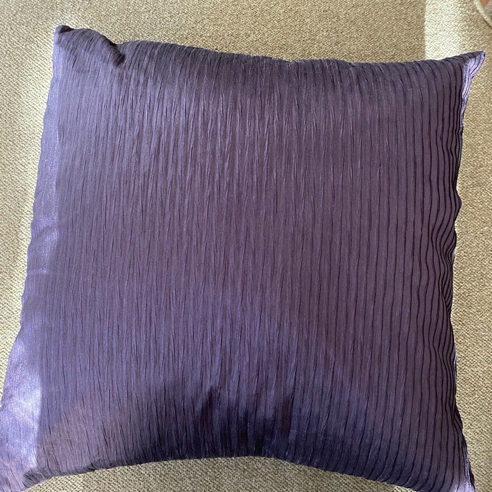 Purple and white throw pillows